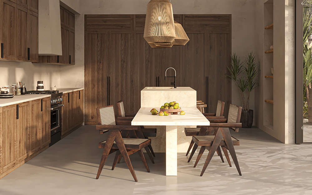 Dark wood-grain cabinetry around a pale stone island that steps down into a dining table